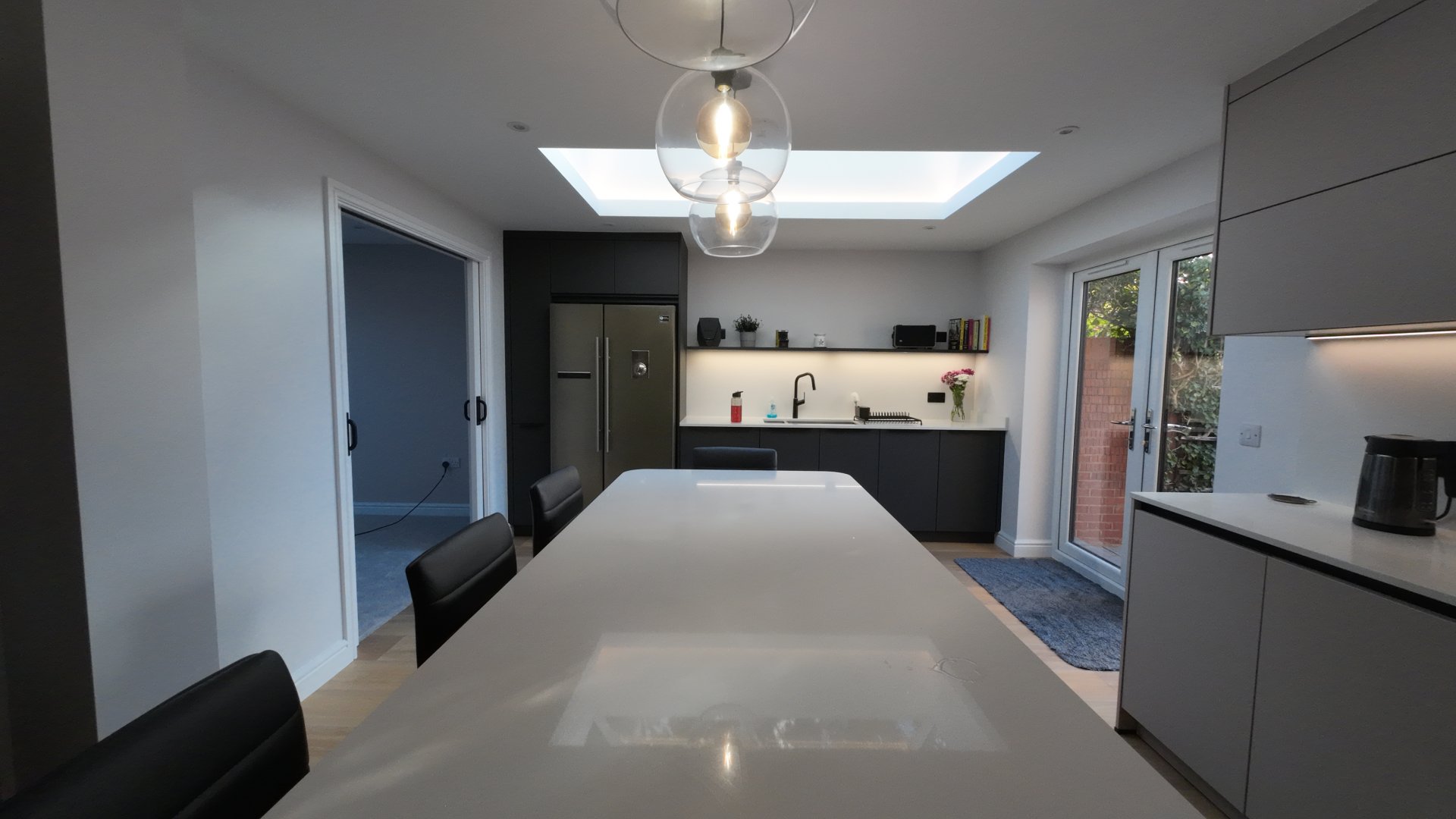 Luxury kitchen extension with two large roof windows flooding the space with natural light
